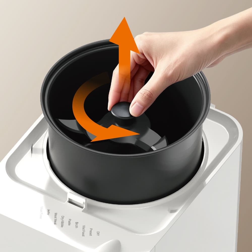 Hand twisting and lifting the Ullopet patented quick-release blade from the inner bowl